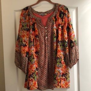 Woman’s plus size sheer top with lining.